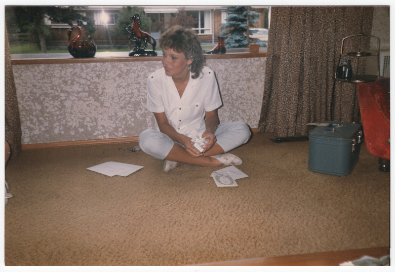 Pamela sitting on the floor.