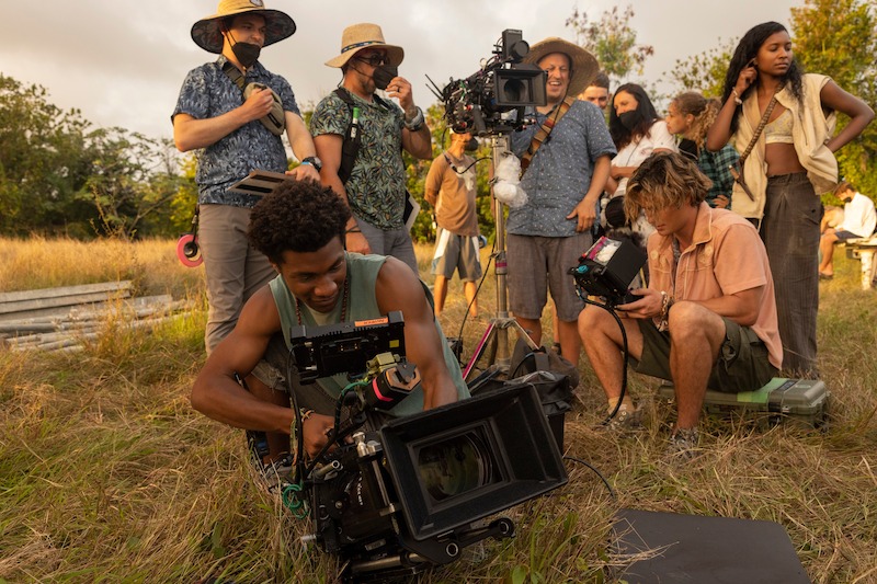 Jonathan Daviss as Pope, Chase Stokes as John B and Carlacia Grant as Cleo in Outer Banks Season 3 Behind-the-Scenes Photo Gallery