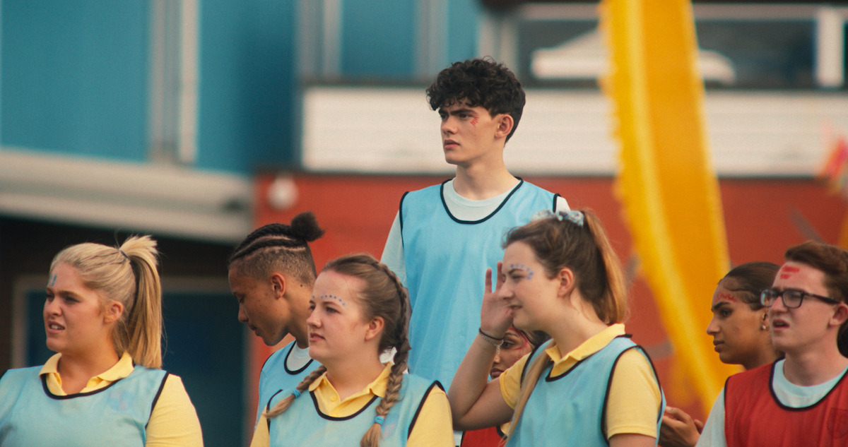 Nick runs to Charlie in the stands