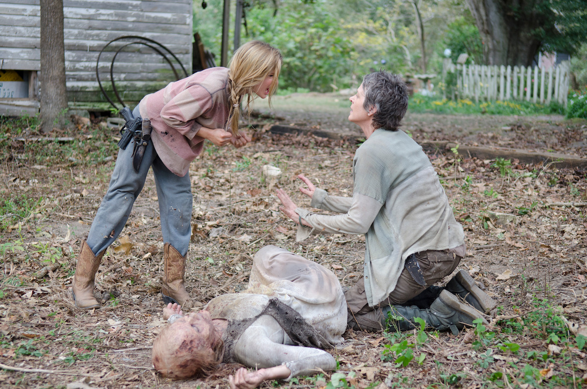 Carol argues with Lizzie over a dead zombie. 