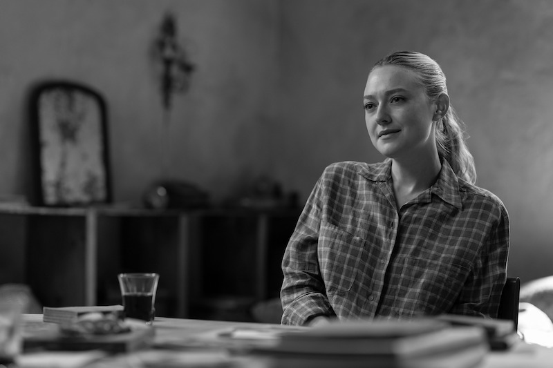 Dakota Fanning as Marge Sherwood seated at a table in 'Ripley'