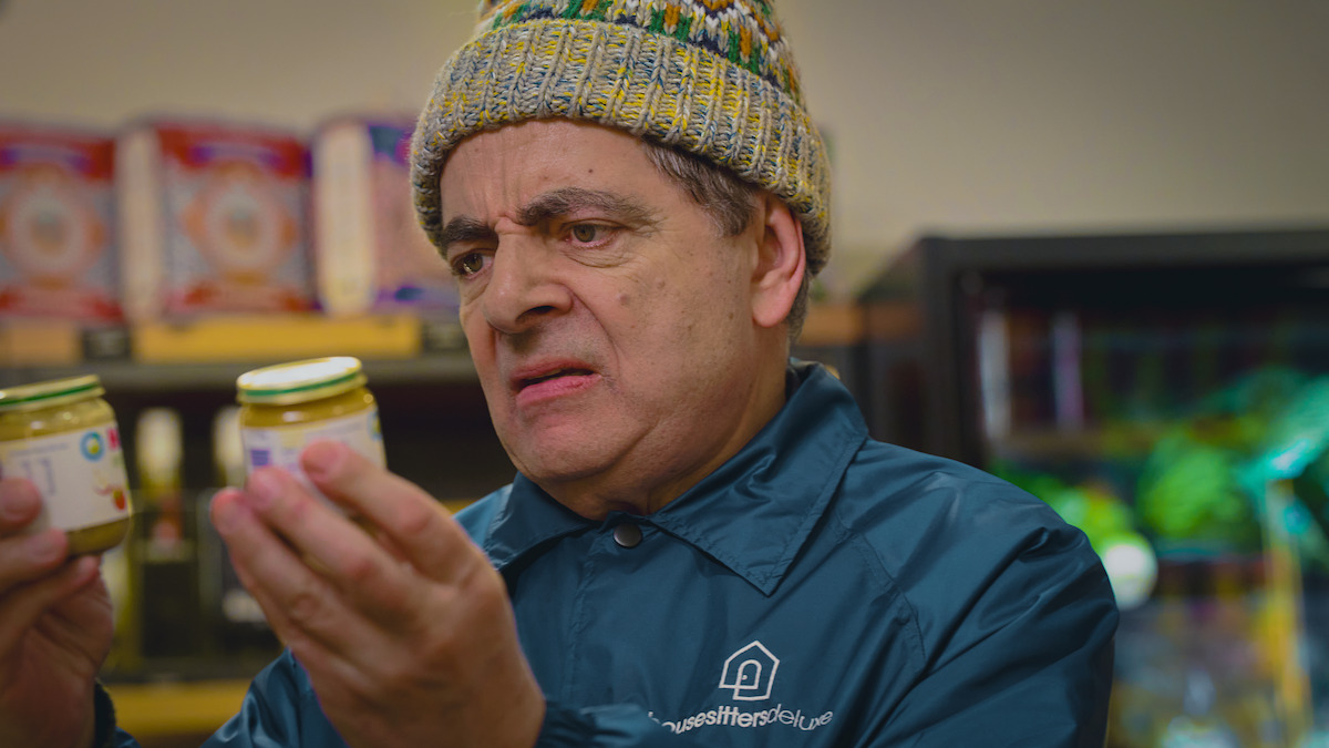 Rowan Atkinson as Trevor Bingley compares baby foods in ‘Man Vs Baby.’
