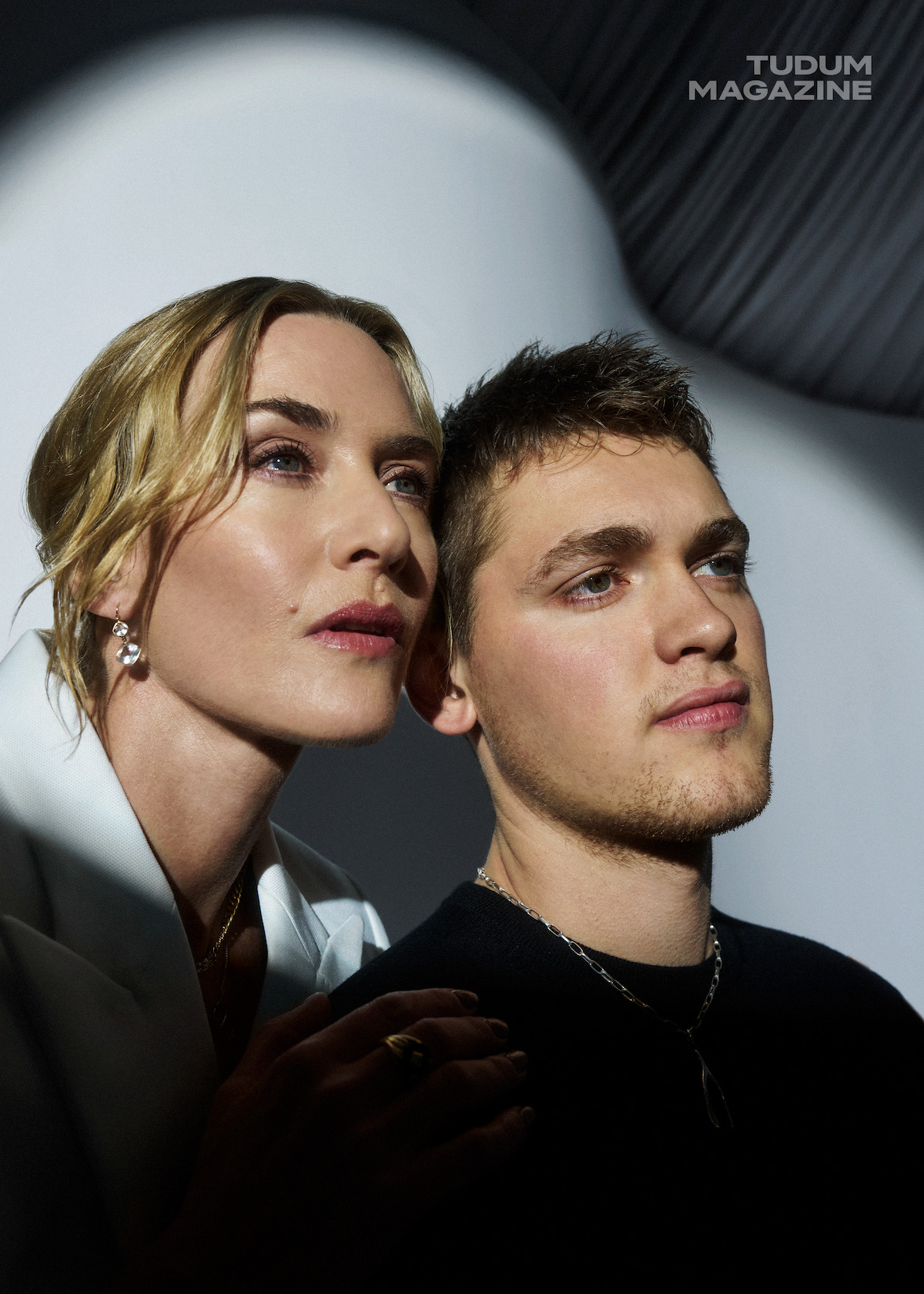 Kate Winslet and screenwriter Joe Anders against a white backdrop.
