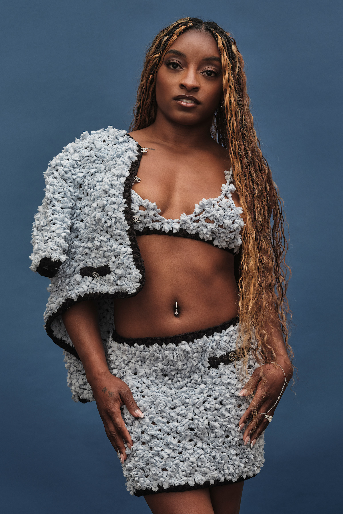 Simone Biles wears a 3-piece blue outfit