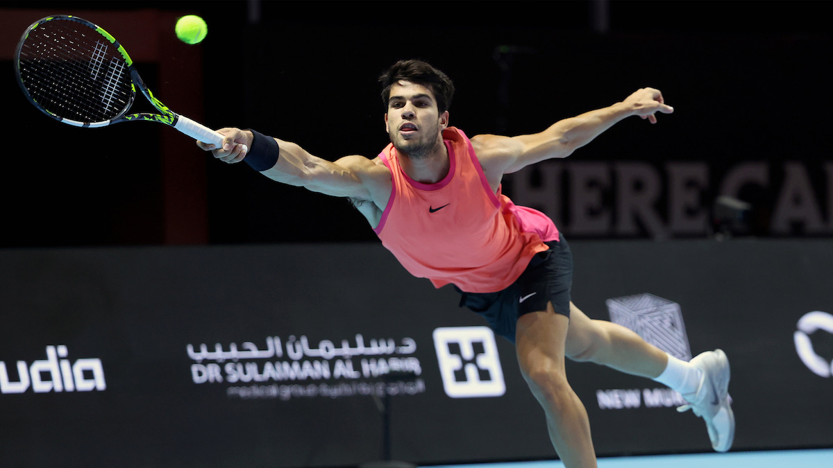 Carlos Alcaraz hitting an outstretched forehand shot during The 2024 6 Kings Slam