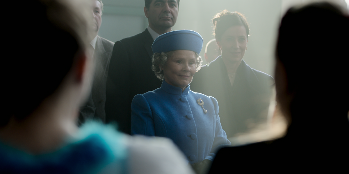 Imelda Staunton as Queen Elizabeth in a blue hat and dress