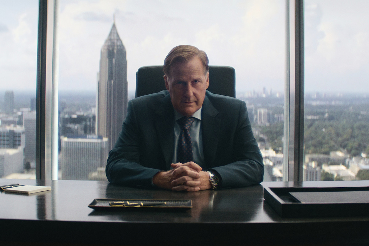 Jeff Daniels as Charlie Croker sits at a desk in ‘A Man in Full’