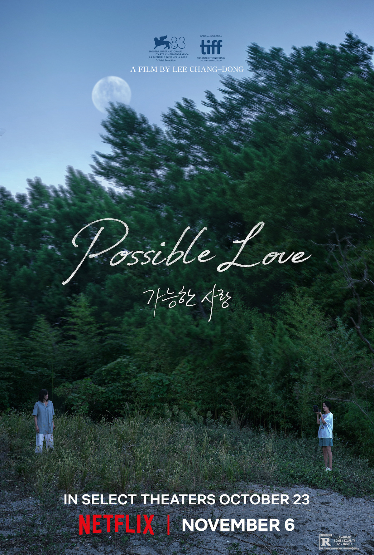 Two people stand apart at the edge of a dense forest under a large moon at dusk; film poster for "Possible Love" by Lee Chang-dong, with release dates for theaters and Netflix.