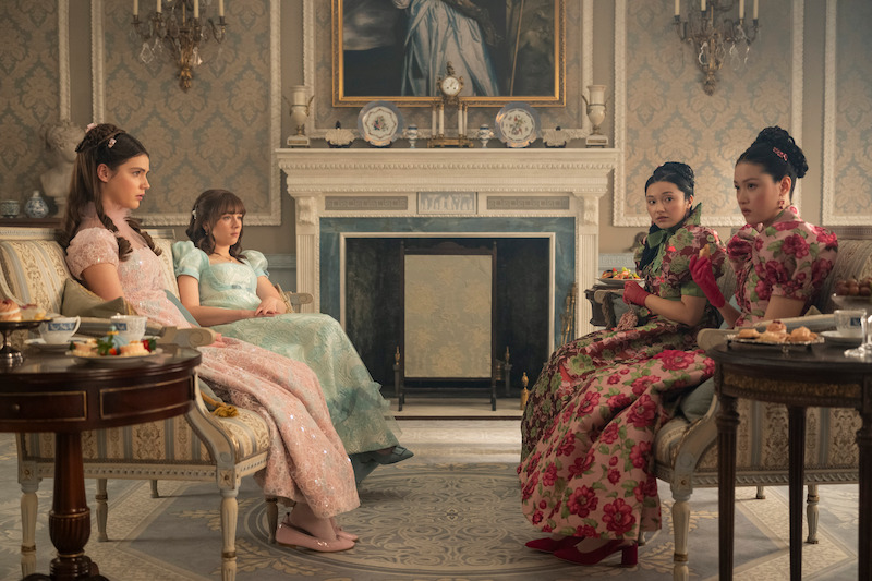 Florence Hunt as Hyacinth Bridgerton, Claudia Jessie as Eloise Bridgerton, Michelle Mao as Rosamund Li, and Isabella Wei as Posy Li in 'Bridgerton' Season 4.