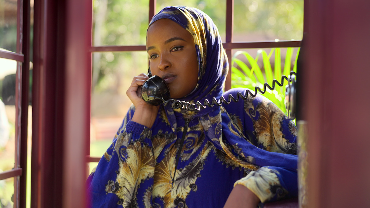 Muna Abdulahi in a phone booth during ‘The Mole’ Season 2.