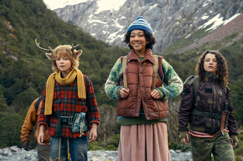 Christian Convery as Gus, Naledi Murray as Wendy, and Stefania LaVie Owen as Becky stand in a mountain range  in Season 3 of 'Sweet Tooth'