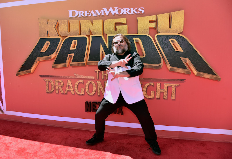Jack Black (Po) shows off his dragon warrior fighting skills on the Kung Fu Panda: The Dragon Knight red carpet.
