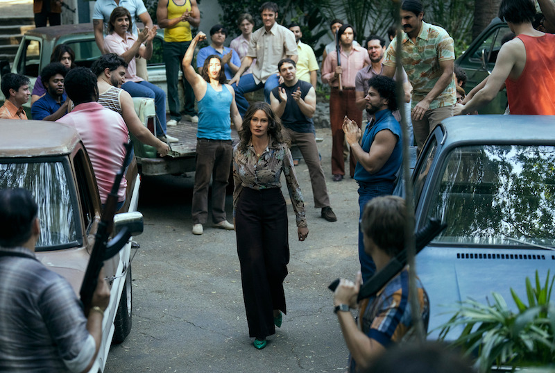 Sofia Vergara as Griselda walking down a crowded street