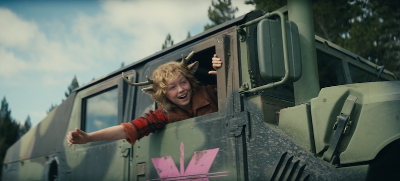 Christian Convery as Gus leans out of the window of a painted tank in Season 3 of 'Sweet Tooth'