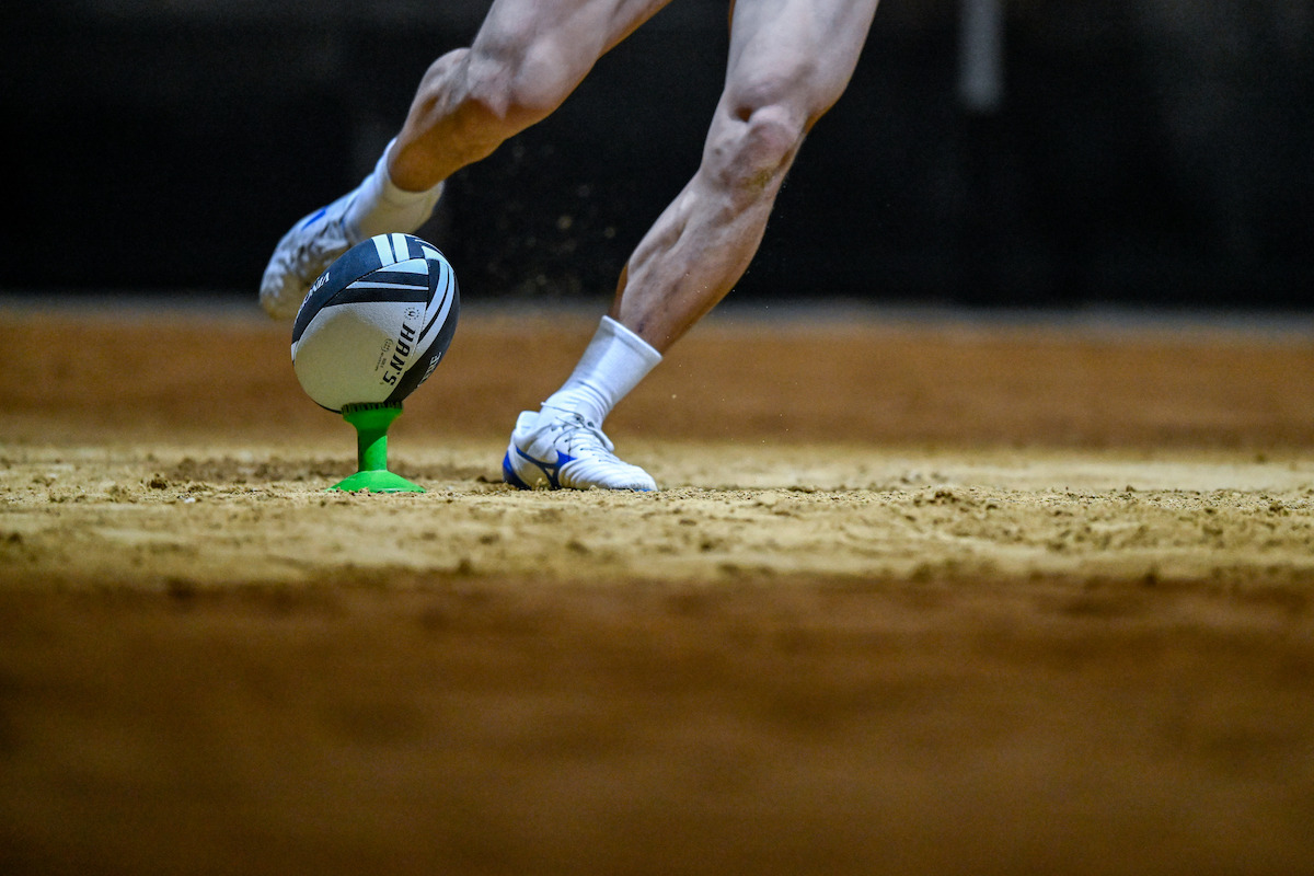A rugby ball about to be kicked in 'Rugged Rugby: Conquer or Die'.