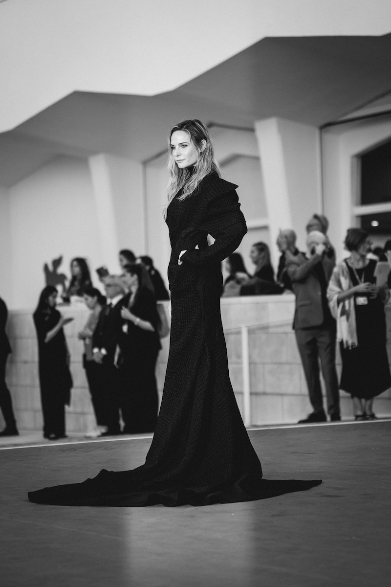 Rebecca Ferguson in a black gown on the red carpet.
