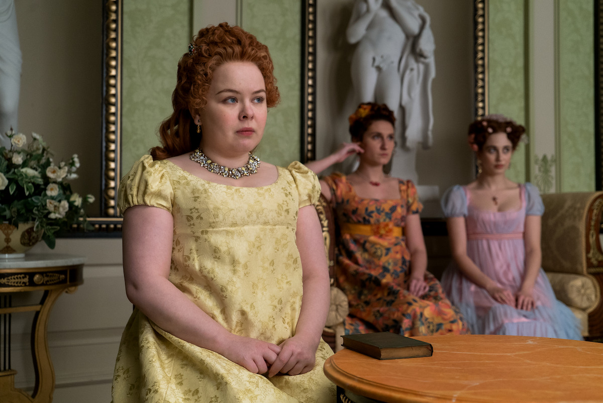 Nicola Coughlan as Penelope Featherington, Bessie Carter as Prudence Featherington, and Harriet Cains as Philippa Featherington in ‘Bridgerton’ Season 1.