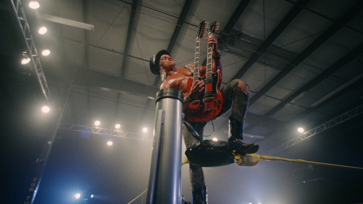  A wrestler plays the guitar on the ropes in Wrestlers. 