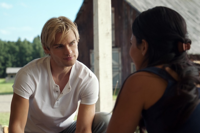 Noah LaLonde as Cole looking at Rodriguez as Jackie in a rural outdoor environment in ‘My Life with the Walter Boys’ Season 2