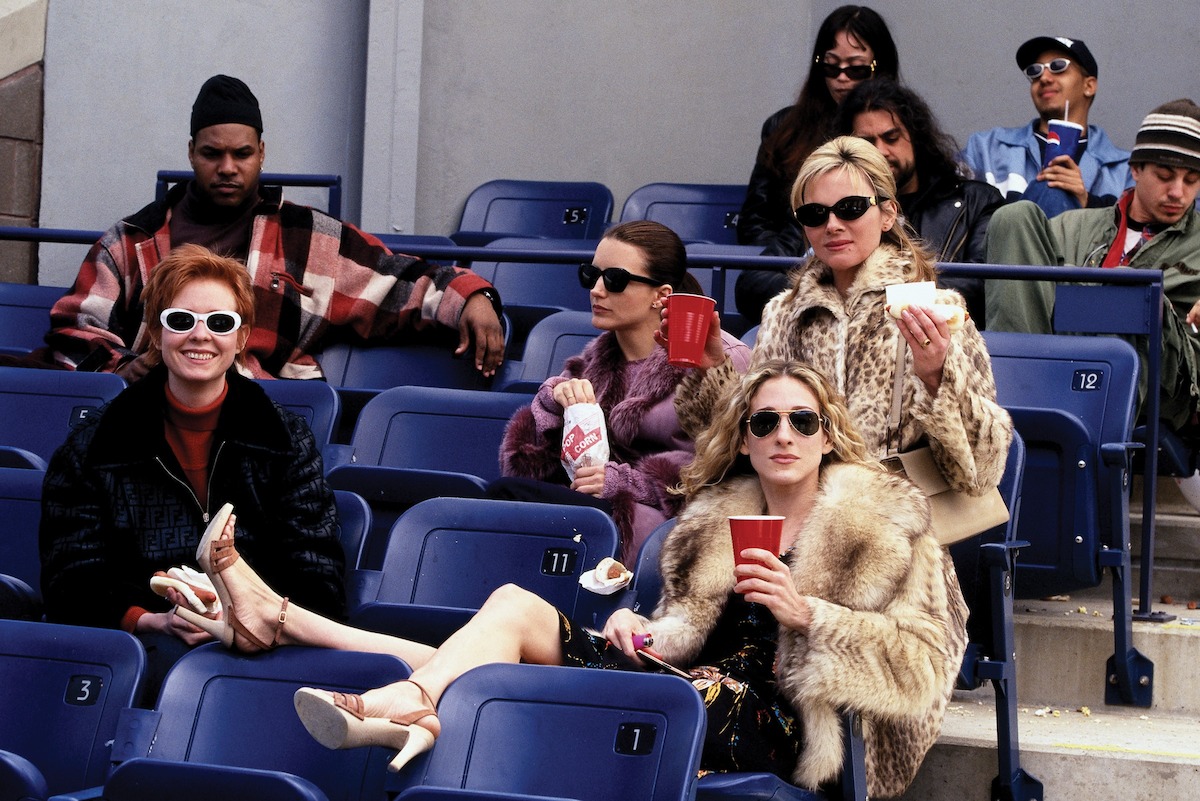 Miranda (Cynthia Nixon), Charlotte (Kristin Davis), Samantha (Kim Cattrall), and Carrie (Sarah Jessica Parker) take in a Yankees game in ‘Sex and the City’ Season 2.