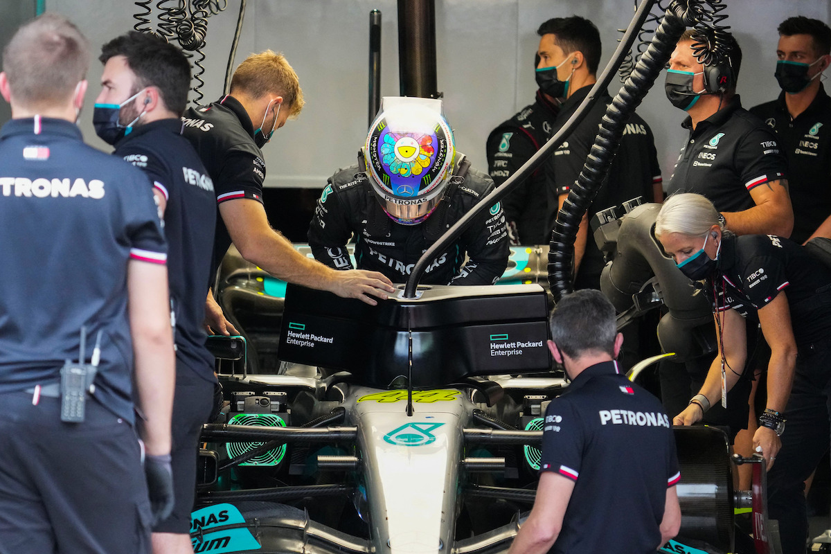 A driver preparing in the pit.