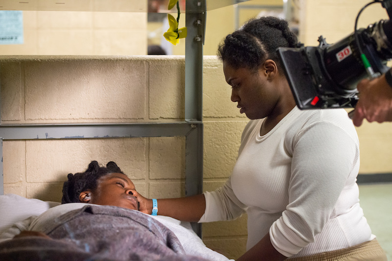(L to R) Uzo Aduba as Suzanne "Crazy Eyes", Danielle Brooks as Tasha "Taystee" on the set of Orange Is The New Black Season 5.