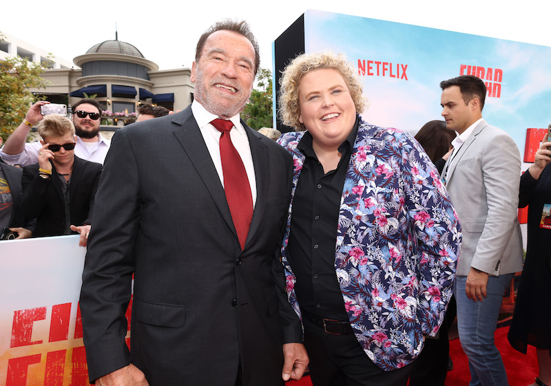Arnold Schwarzenegger and Fortune Feimster at the FUBAR red carpet premiere.
