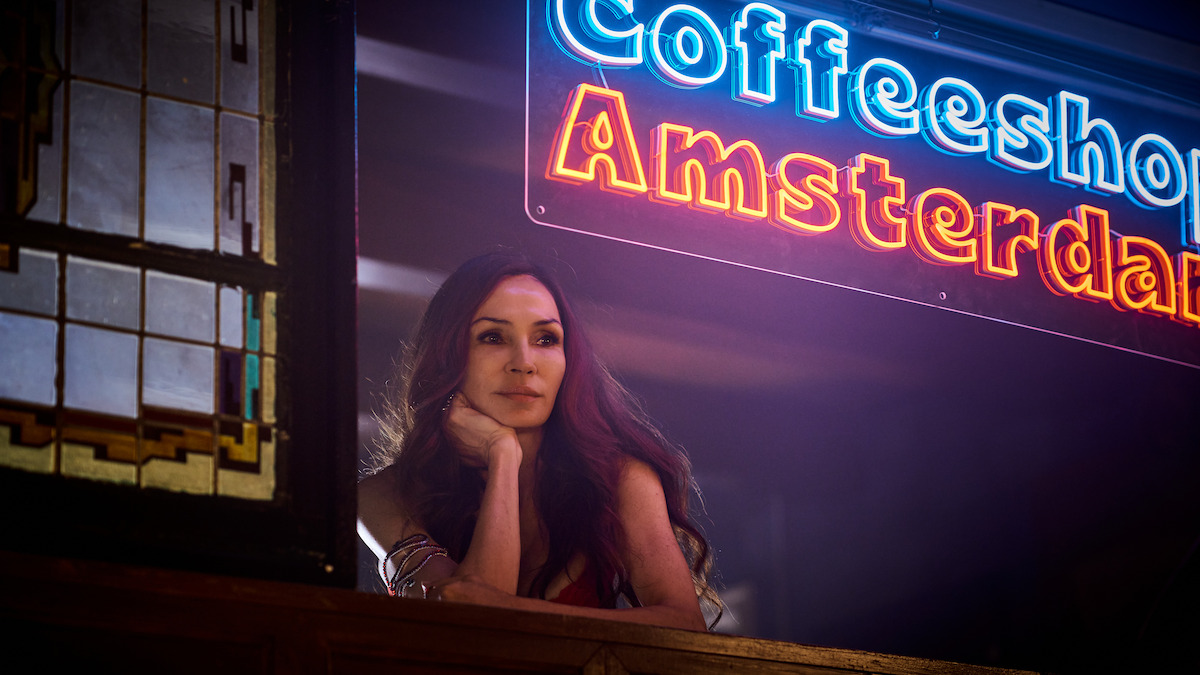 Famke Janssen as Betty Jonkers stares out a window in ‘Amsterdam Empire.’
