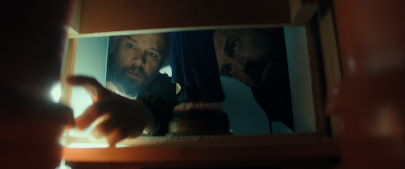 Ben Affleck as Detective Sergeant J.D. Byrne and Matt Damon as Lieutenant Dane Dumars in 'The Rip.'