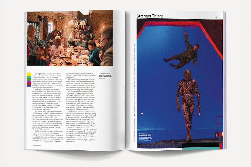 A magazine spread showing people gathered around a dinner table in a cozy, warmly lit room on the left page, and actors on a blue screen set for Stranger Things, with one suspended in air and another in costume, on the right page.