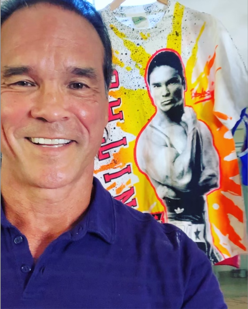 Clark stands proudly by a T-shirt with his likeness from the Gladiator days. 