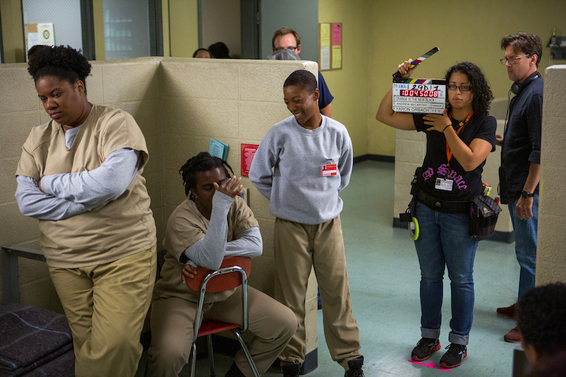 (L to R) Adrienne C. Moore as Cindy, Uzo Aduba as Suzanne "Crazy Eyes", Samira Wiley as Poussey, Andrew McCarthy (Director) on the set of Orange Is The New Black Season 2.