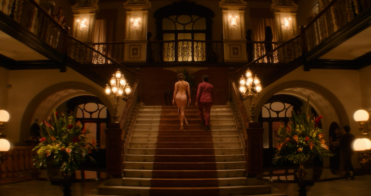 Jennifer Lopez and Gael Garcia Bernal walk up a grand staircase in an extended scene from 'The Mother.'