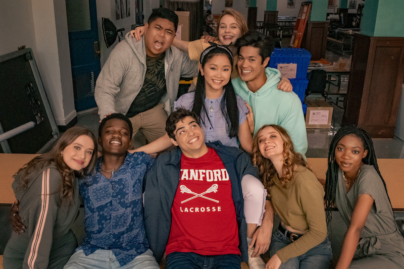 Cast poses for a group photo.