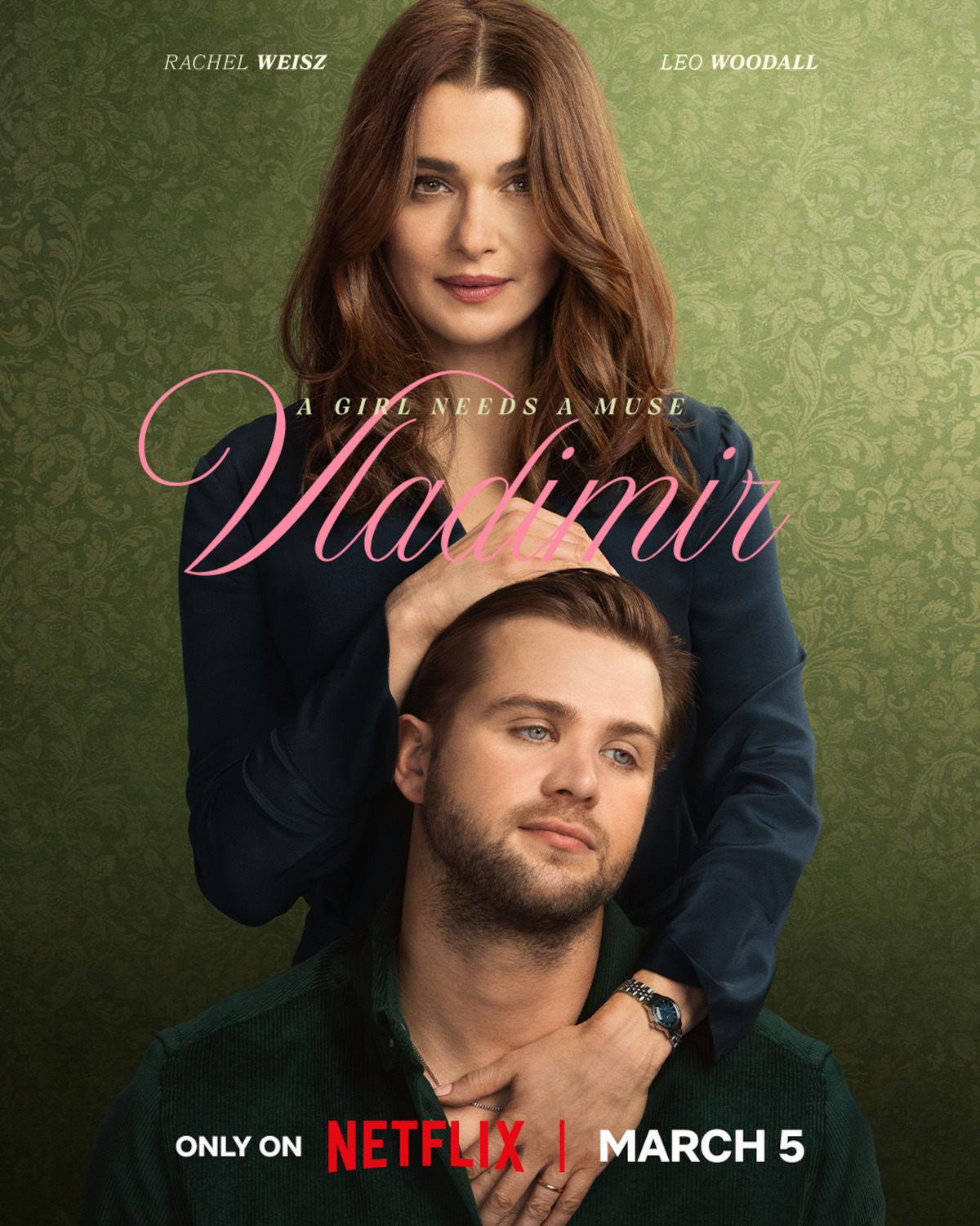 A woman with long brown hair gently rests her hands on a younger man’s head; both pose against an ornate green patterned backdrop. The image has text featuring names and the title "Vladimir" in elegant font on the foreground.