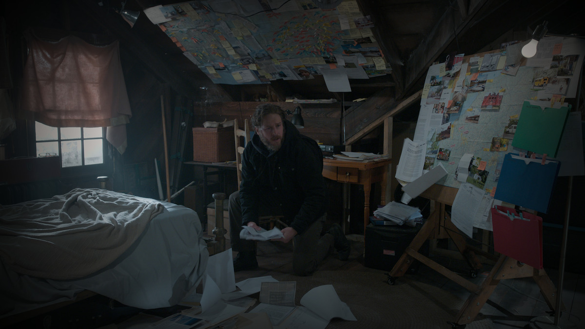 A man surrounded by notes and bulletins.