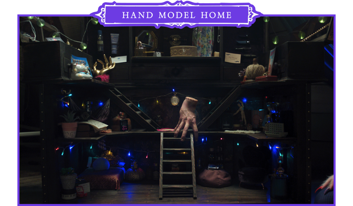 Thing in his house decorated with string lights in ‘Wednesday’ Season 2.