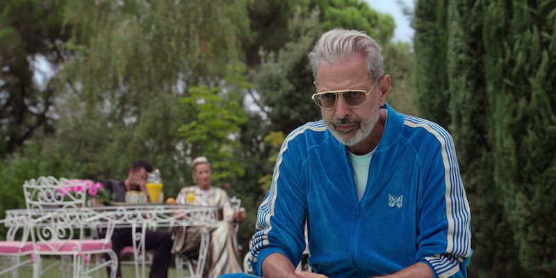 Jeff Goldblum as Zeus wears a blue tracksuit in Season 1 of ‘Kaos’