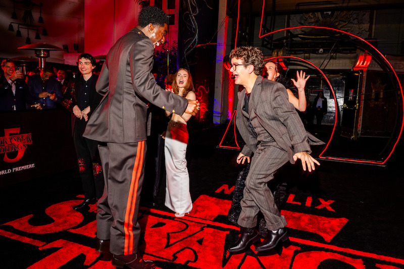 Finn Wolfhard, Caleb McLaughlin, Sadie Sink, Gaten Matarazzo, and Millie Bobby Brown attend the 'Stranger Things' Season 5 World Premiere.
