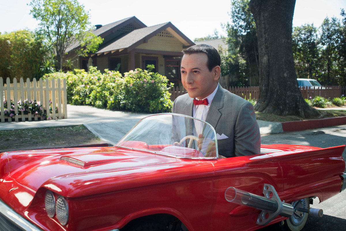 good movie recommendations family A man wearing a suit sits in a small car