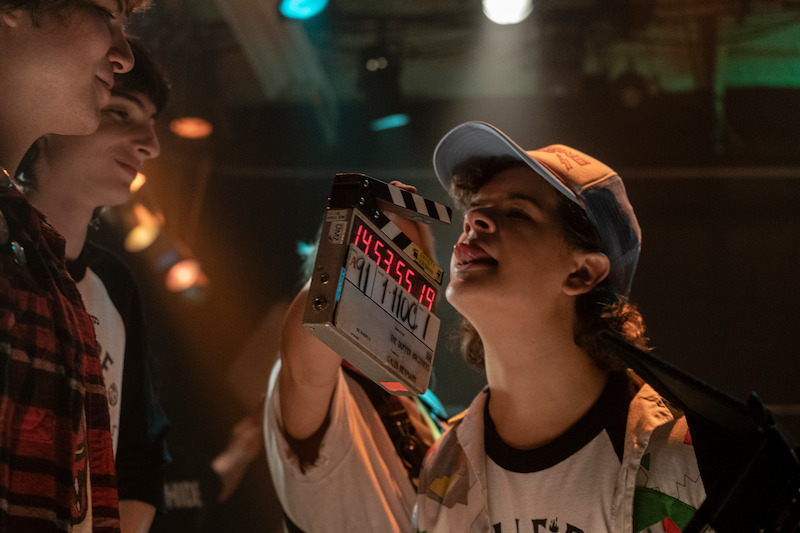 Dustin Henderson (Gaten Matarazzo) strikes a pose. - Hellfire Club assemble! - 68 Behind-the-Scenes pics from ‘Stranger Things’ Season 4 You Have to See