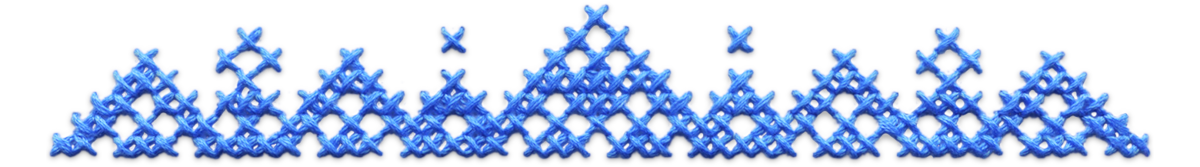 Ornate blue cross stitched top divider.