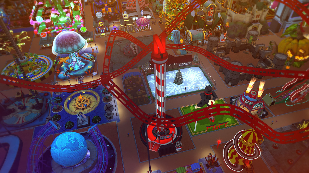 An in-game screenshot from the mobile game ‘Rollercoaster Tycoon Touch,’ featuring a dazzling theme park at night with a variety of lit-up rides and attractions