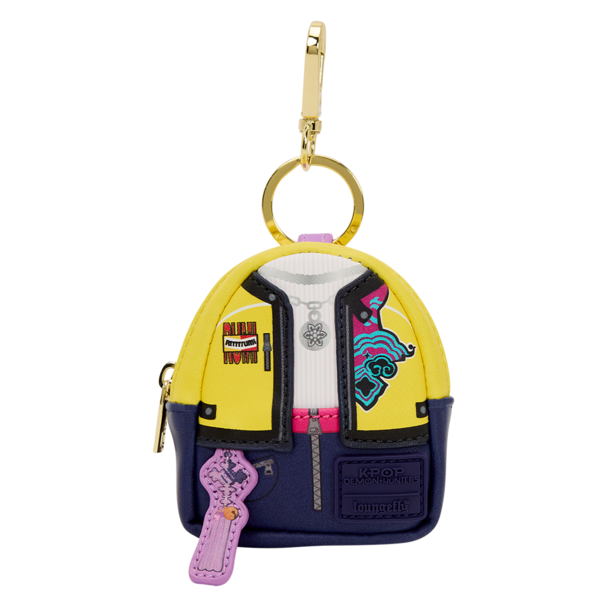 Miniature backpack-shaped keychain with yellow, blue, and white color blocks, zipper accents, patches, a pink key fob, and a gold key ring clip.