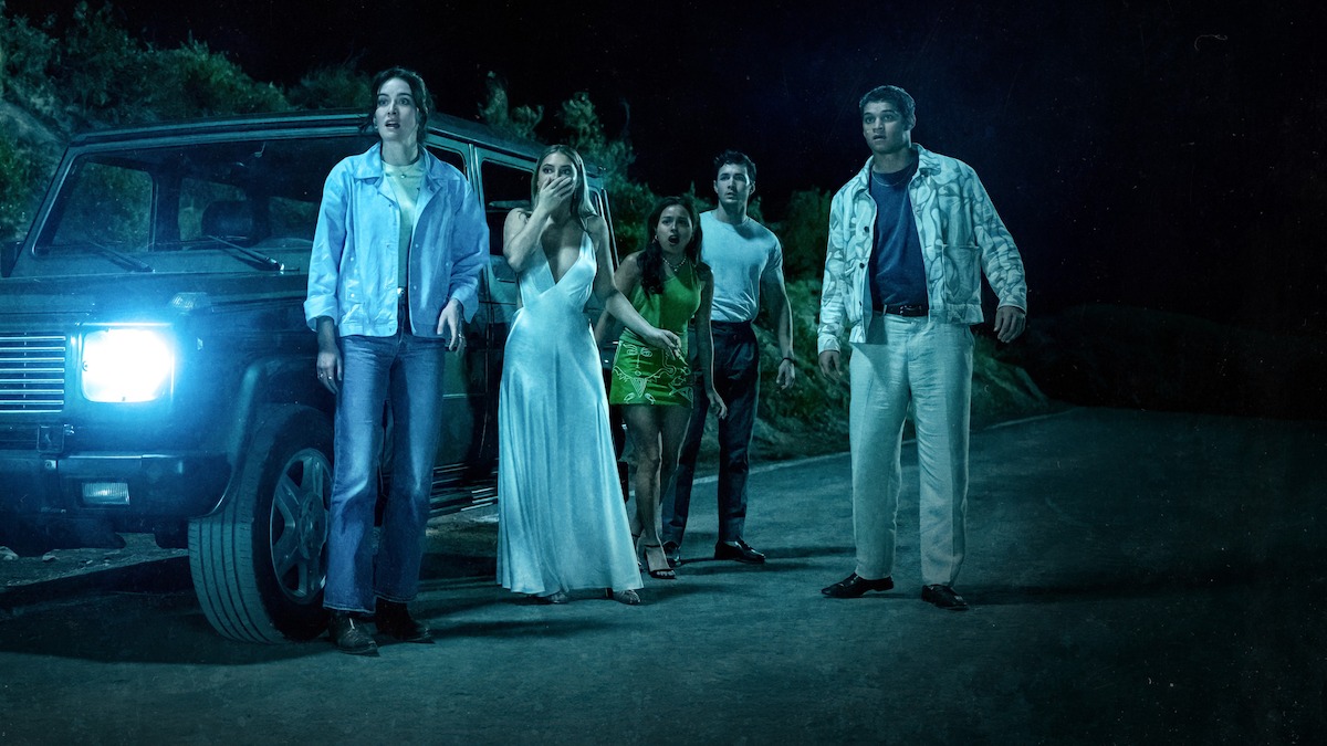 Chase Sui Wonders as Ava Brucks, Madelyn Cline as Danica Richards, Tyriq Withers as Teddy Spencer, Jonah Hauer-King as Milo Griffin, and Sarah Pidgeon as Stevie Ward watch in horror as a car careens off the road in ‘I Know What You Did Last Summer.’