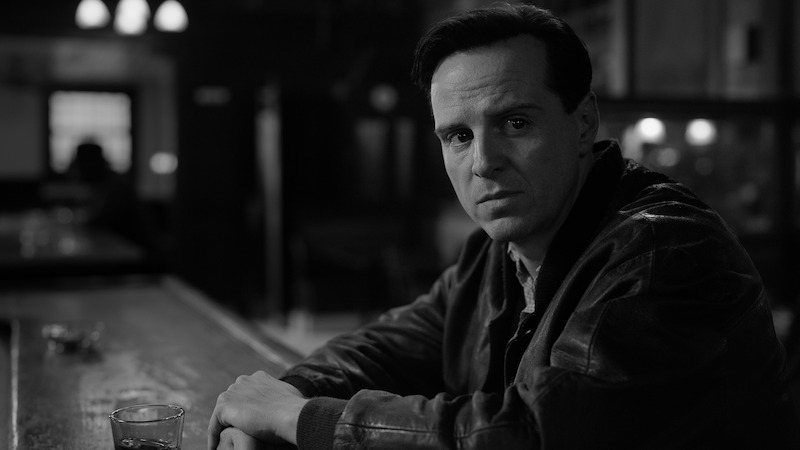Andrew Scott as Tom Ripley sits at a bar in 'Ripley'