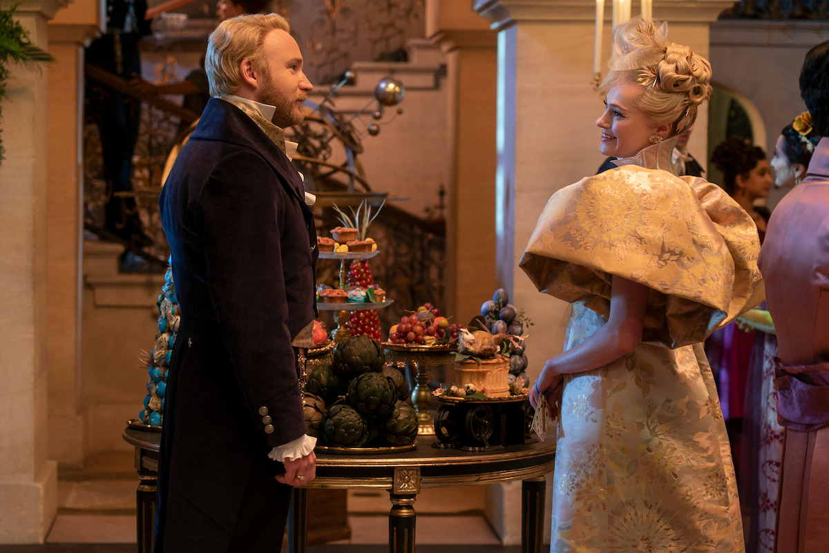 Sam Phillips as Lord Debling and Jessica Madsen as Cressida Cowper face each other at a ball in Season 3 of ‘Bridgerton.’