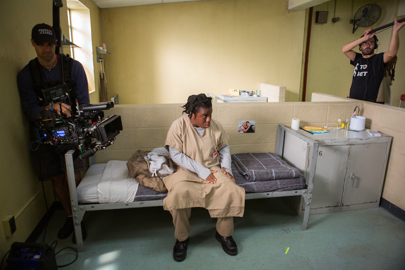 (L to R) Ludovic Littee (Director of Photography), Uzo Aduba as Suzanne "Crazy Eyes" on the set of Orange Is The New Black Season 2.