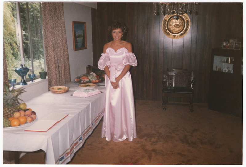 Pamela in a pink dress.