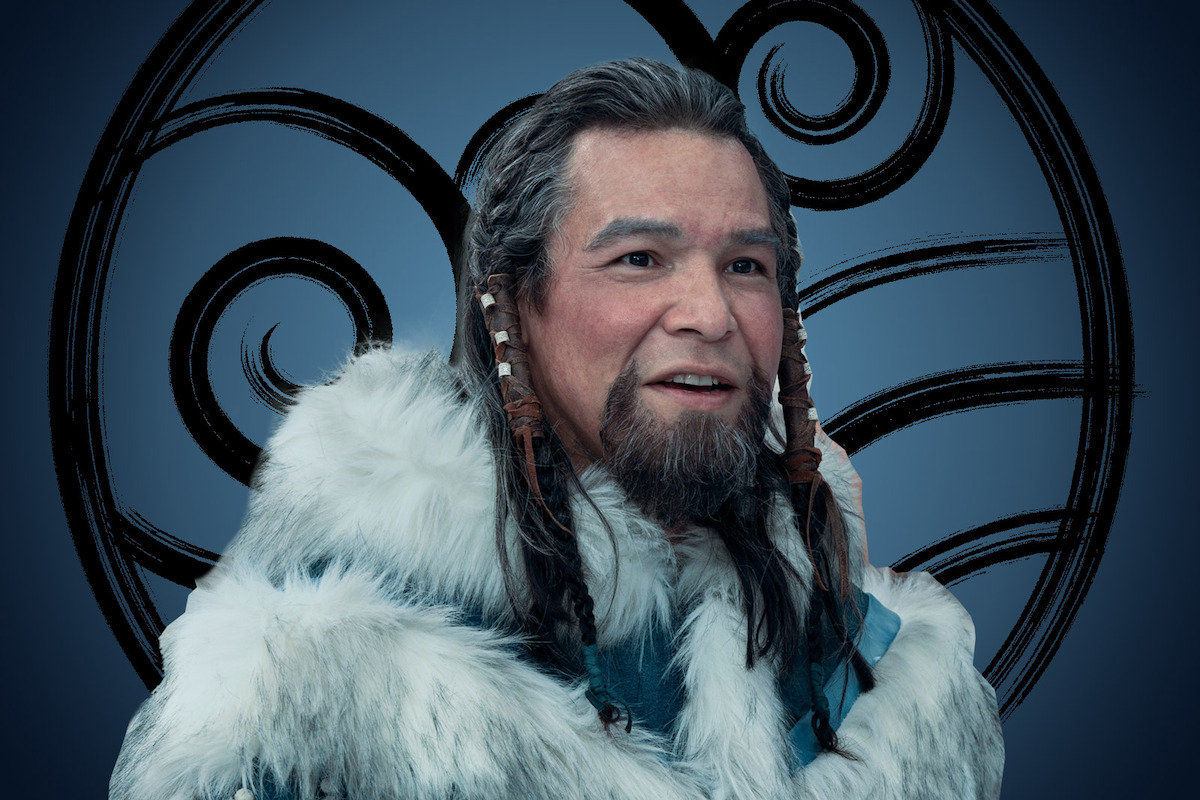 Nathaniel Arcand as Chief Arnook smiles and wears a fur cloak in season 1 of Avatar: The Last Airbender